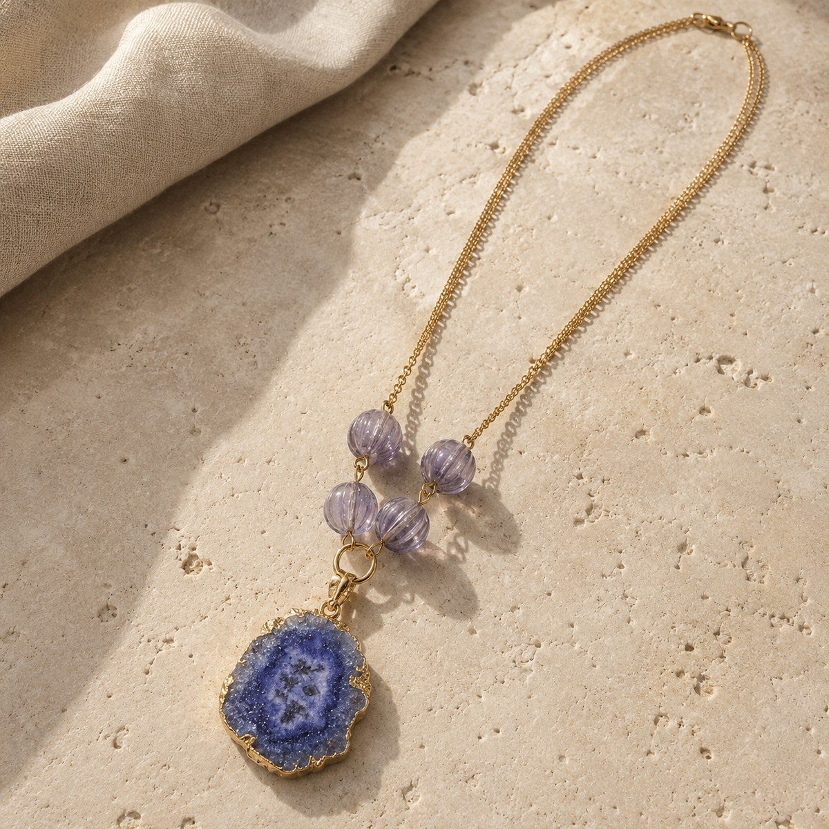 Blue Agate Slice Gold-Tone Pendant Necklace in a displayed product view