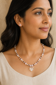 Blush Agate Heart Pendant Necklace Set in a styled detail view