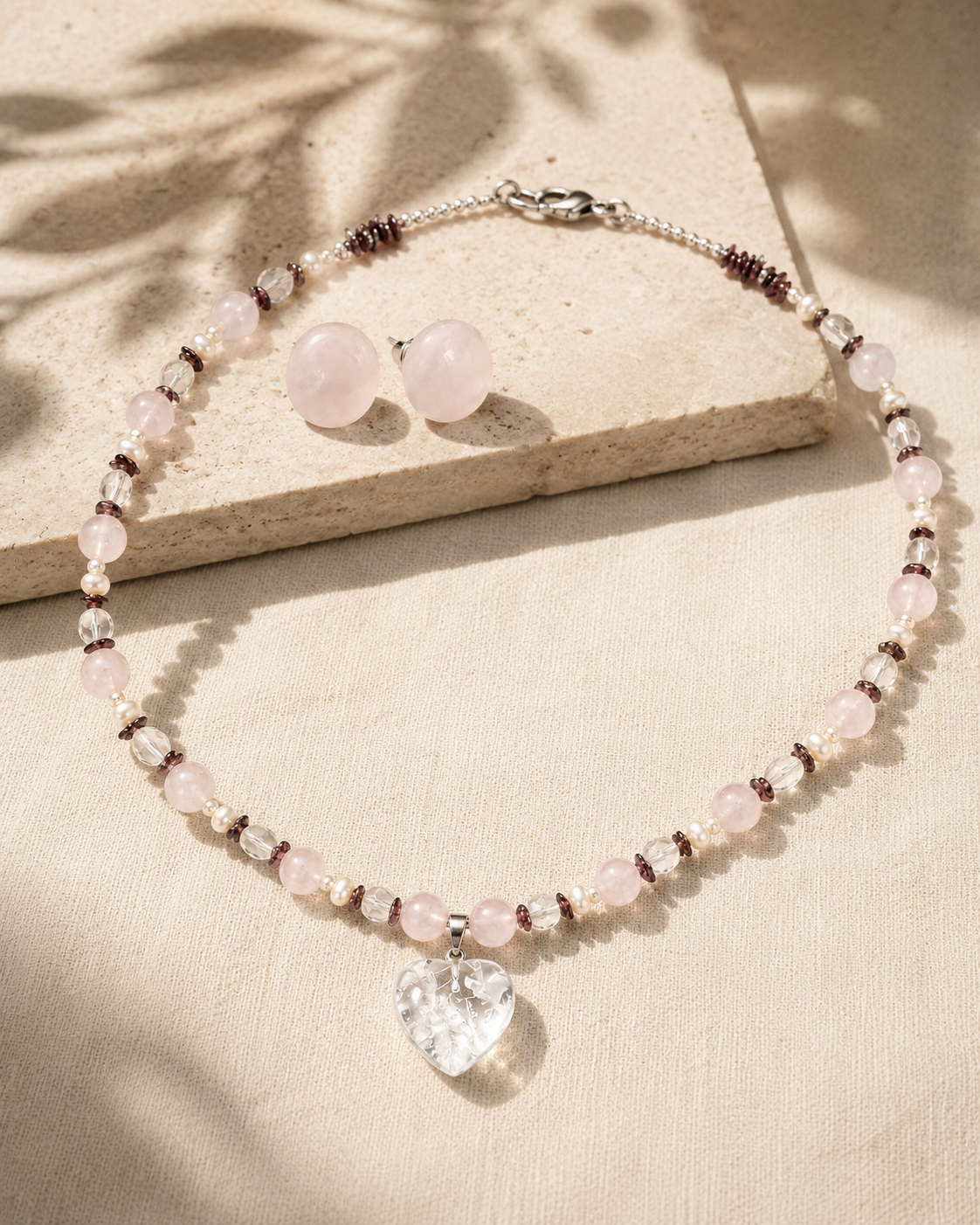 Blush Agate Heart Pendant Necklace Set in a styled flat lay