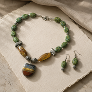 Green Elephant Pendant Statement Set in a styled detail view