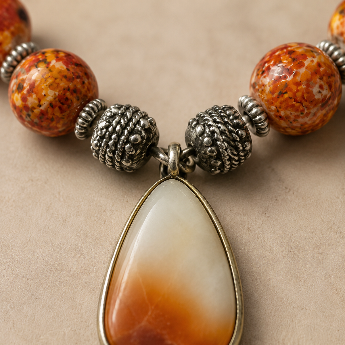 Orange Sunset Agate Pendant Set in a displayed product view