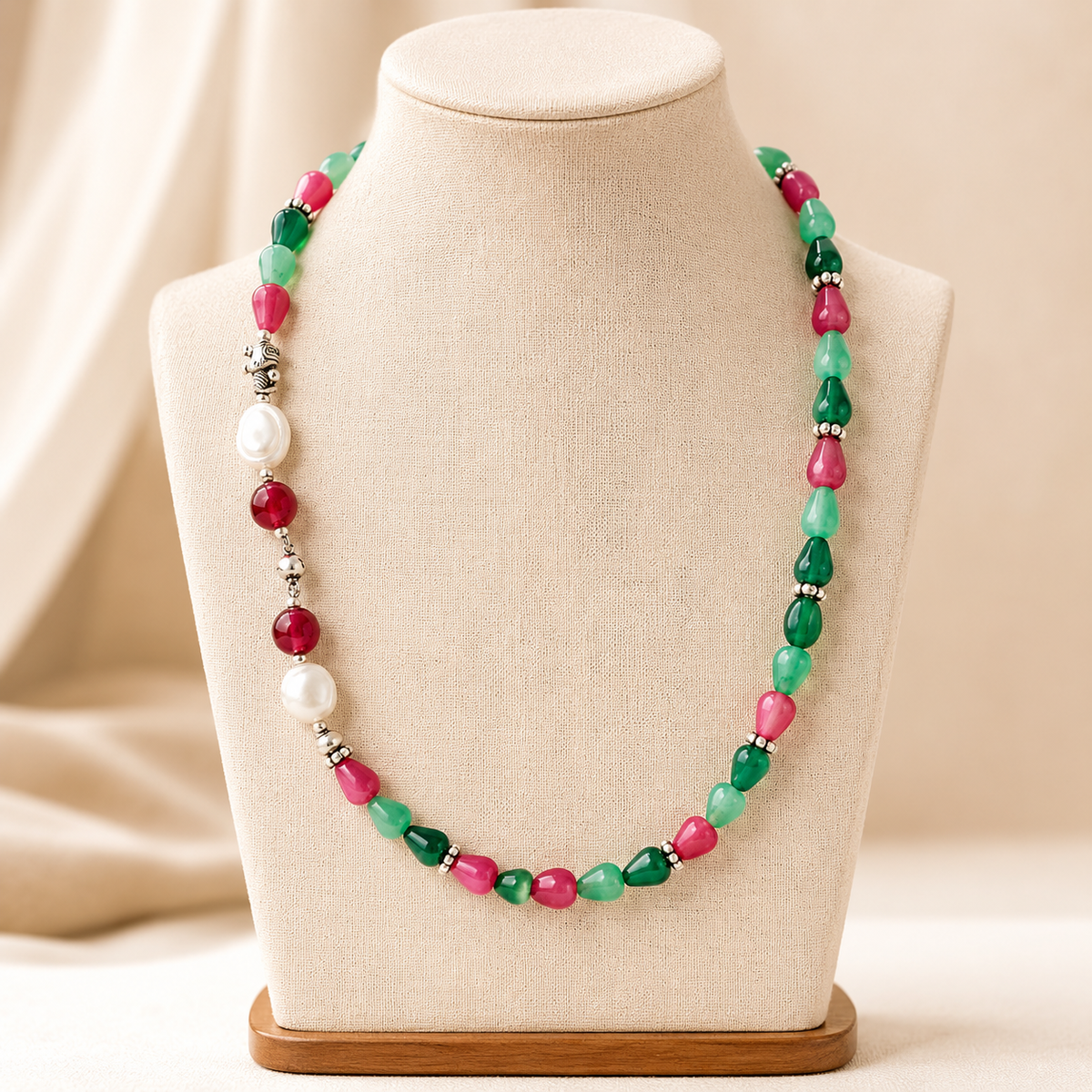 Full view of Emerald Ruby Teardrop Necklace showing necklace proportions