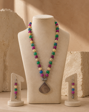 Angled view of Multicolour Chakra Fan Pendant Set handcrafted by Pathrohi