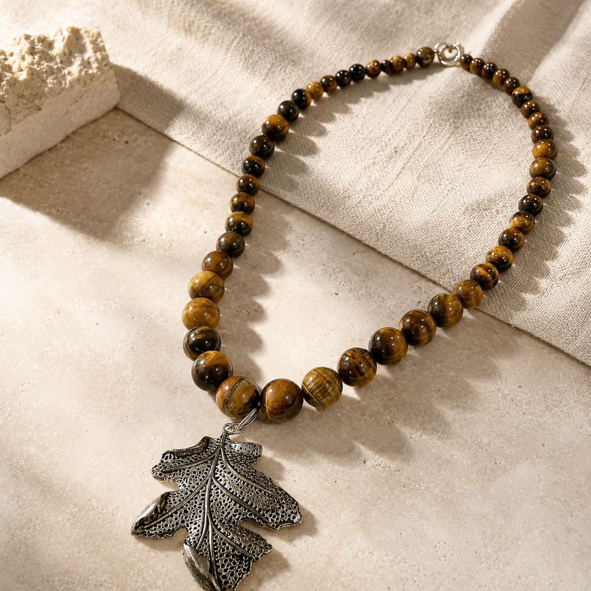 Detailed view of Tiger Eye Leaf Pendant Necklace showing stone and bead arrangement