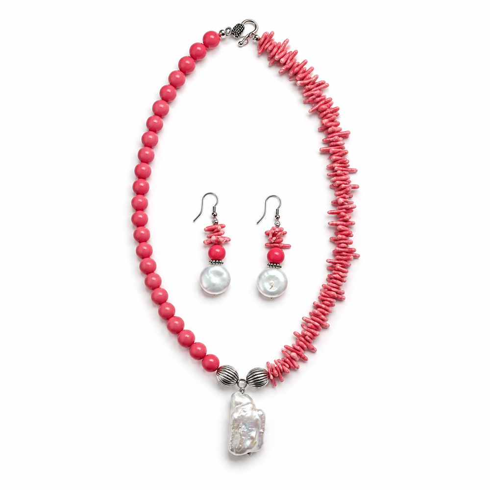 Close-up view of Coral Pearl Asymmetric Statement Set showing handcrafted details