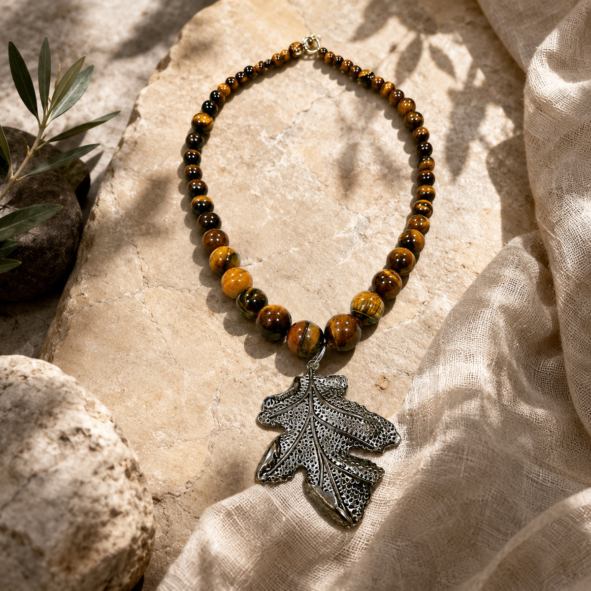 Close-up of Tiger Eye Leaf Pendant Necklace showing pendant and finishing details
