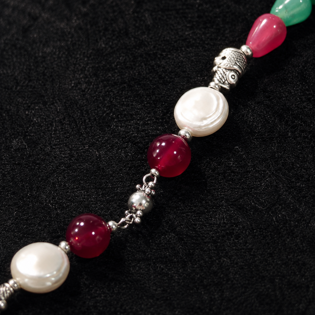 Detailed view of Emerald Ruby Teardrop Necklace showing stone and bead arrangement