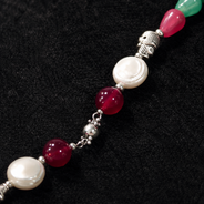 Detailed view of Emerald Ruby Teardrop Necklace showing stone and bead arrangement