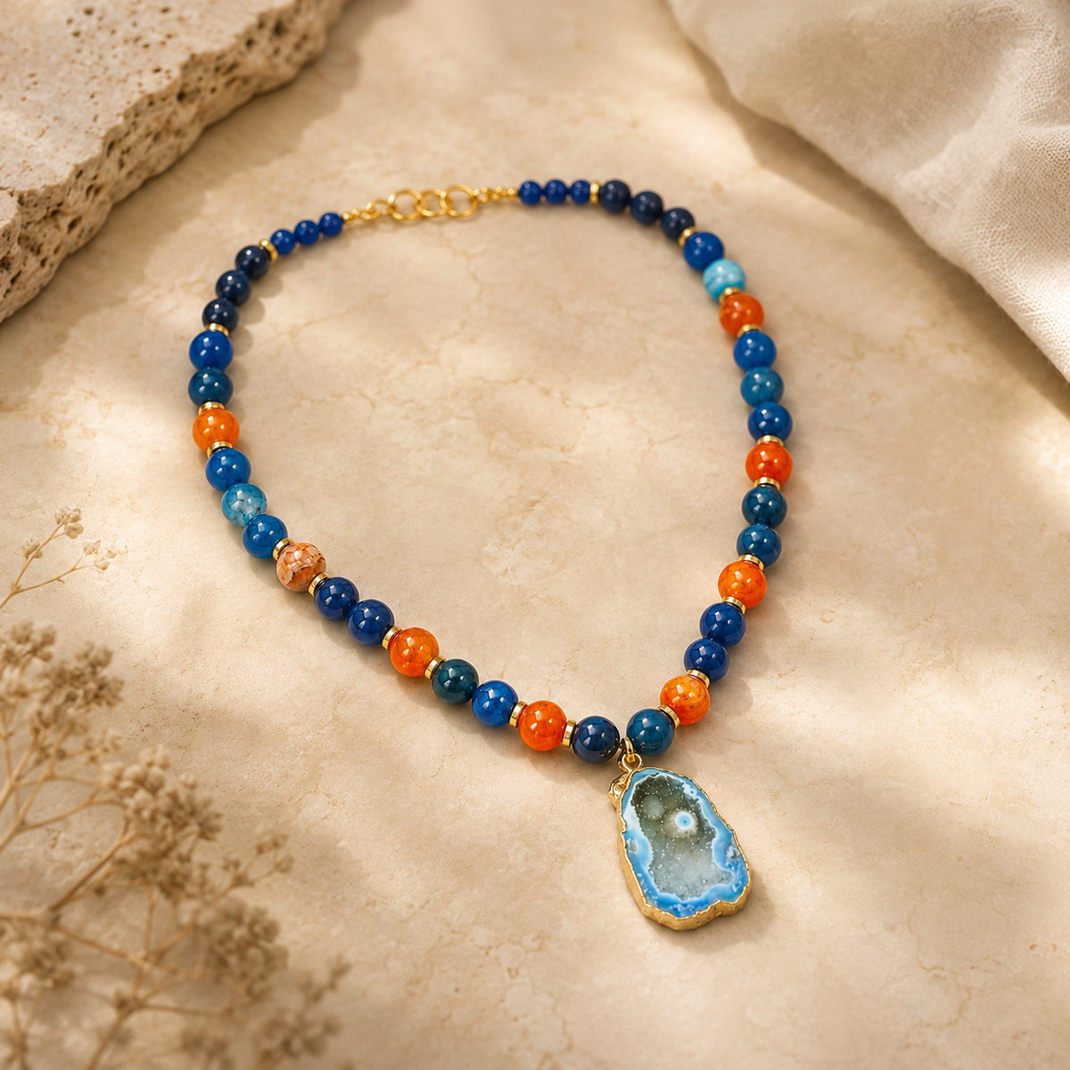 Angled view of Cobalt Blue Agate Slice Pendant Necklace handcrafted by Pathrohi