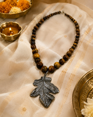 Additional styling view of Tiger Eye Leaf Pendant Necklace by Pathrohi