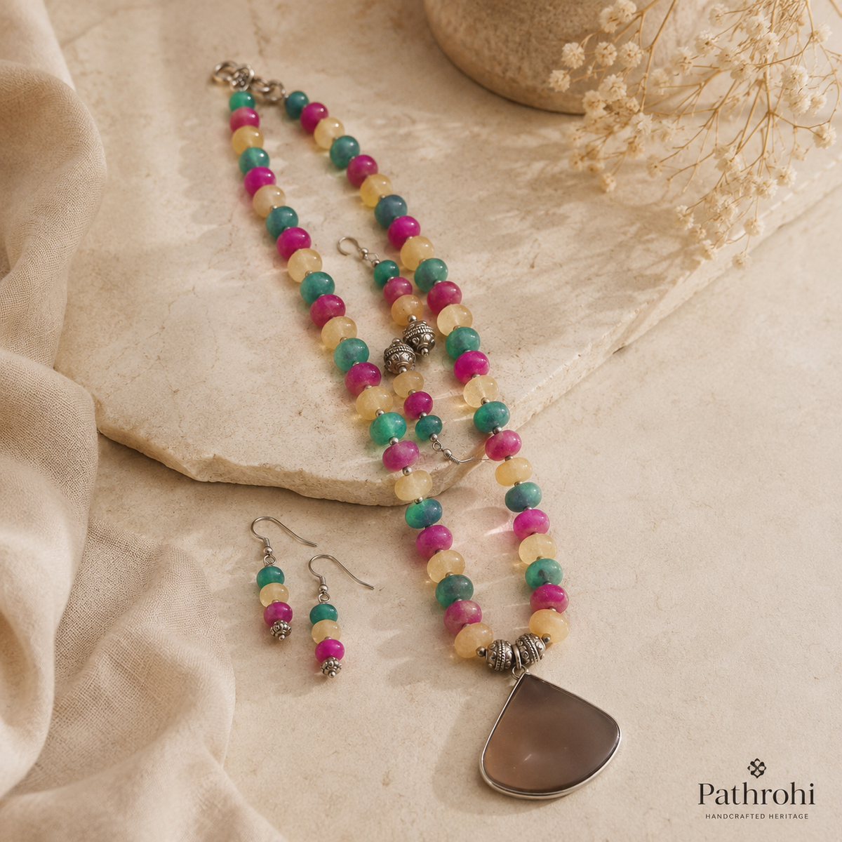 Detailed view of Multicolour Chakra Fan Pendant Set showing stone and bead arrangement