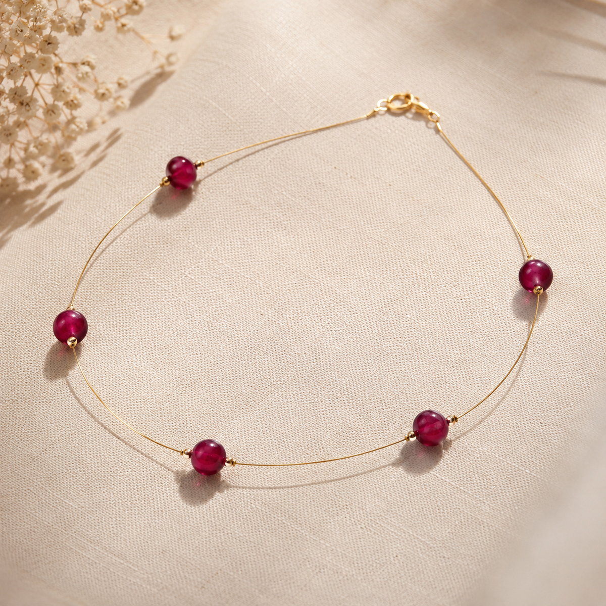 Angled view of Ruby Dew Fine Wire Necklace handcrafted by Pathrohi