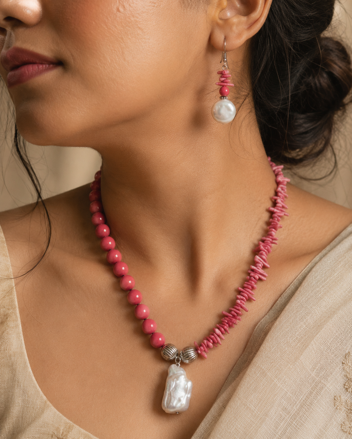 Angled view of Coral Pearl Asymmetric Statement Set handcrafted by Pathrohi