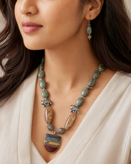 Detailed view of Green Elephant Pendant Statement Set showing stone and bead arrangement