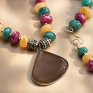 Close-up view of Multicolour Chakra Fan Pendant Set showing handcrafted details