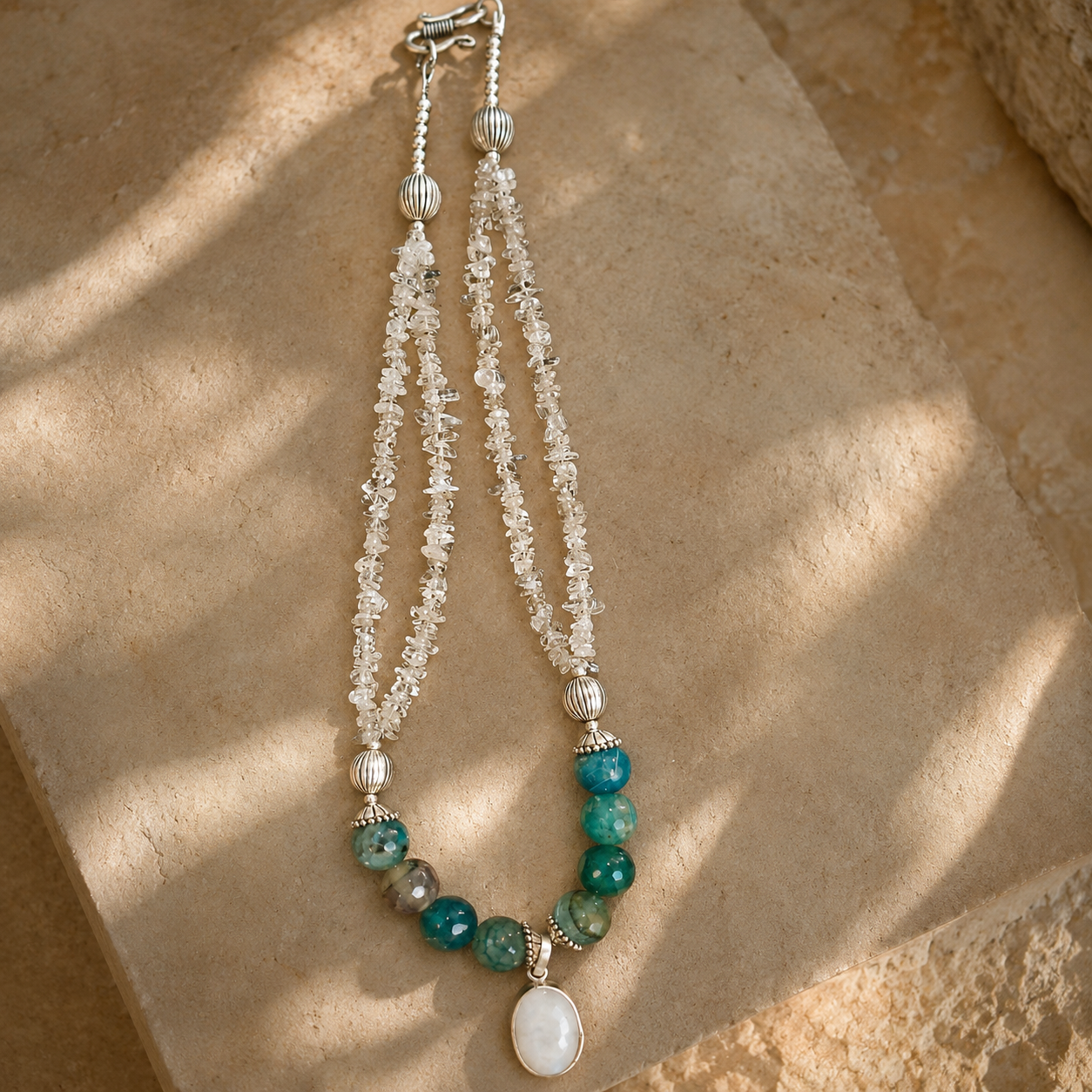 Front view of Clear Stone & Aqua Agate Drop Necklace handcrafted by Pathrohi