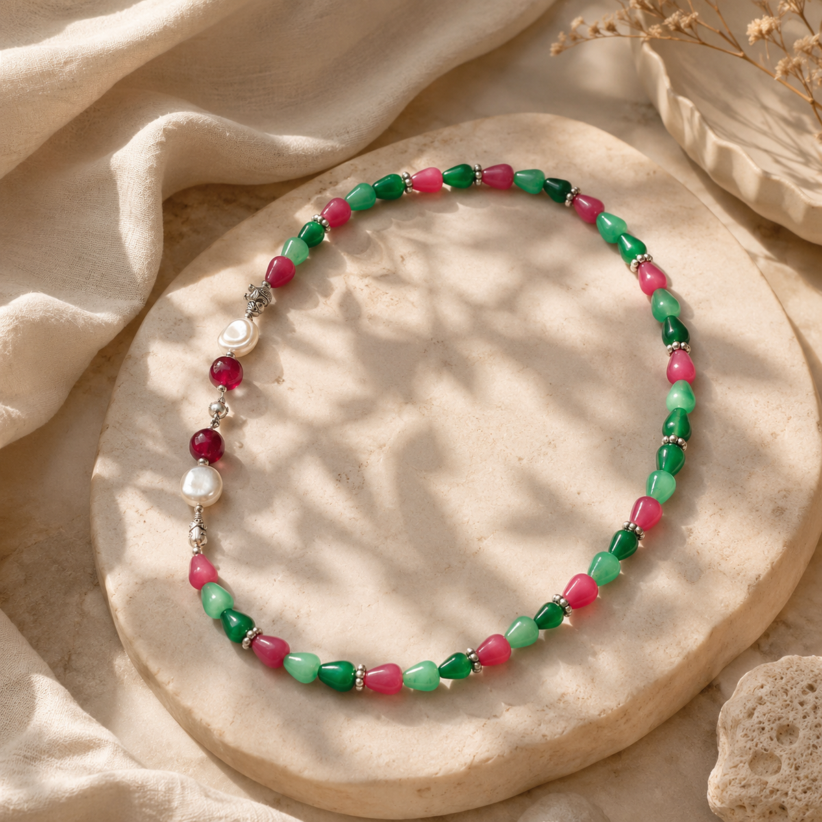 Close-up of Emerald Ruby Teardrop Necklace showing pendant and finishing details