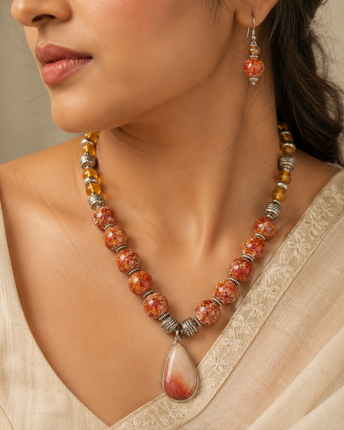 Detailed view of Orange Sunset Agate Pendant Set showing stone and bead arrangement