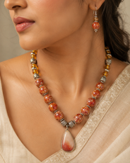 Detailed view of Orange Sunset Agate Pendant Set showing stone and bead arrangement