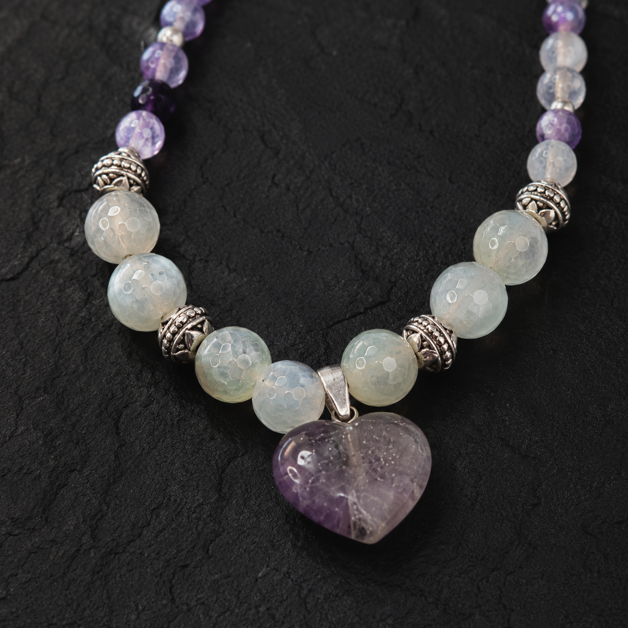 Detailed view of Amethyst Moon Heart Pendant Necklace showing stone and bead arrangement