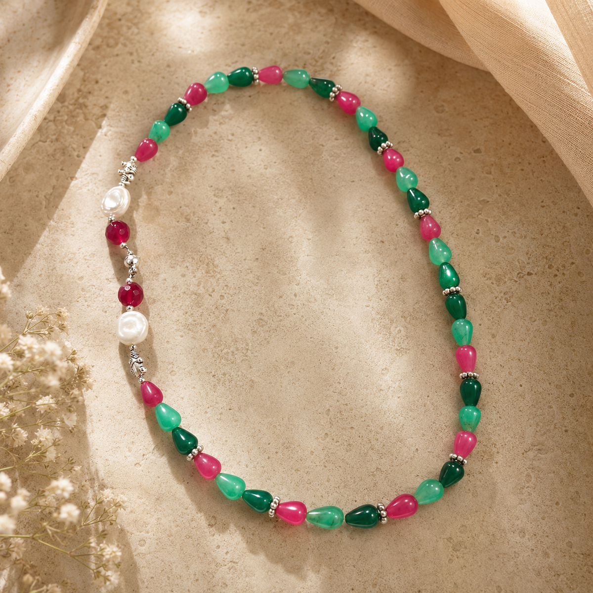 Front view of Emerald Ruby Teardrop Necklace handcrafted by Pathrohi